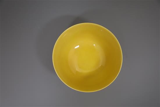 A Chinese yellow glazed sgraffito dragon bowl, Qianlong seal mark and of the period (1736-95), Diam.13.3cm, restored